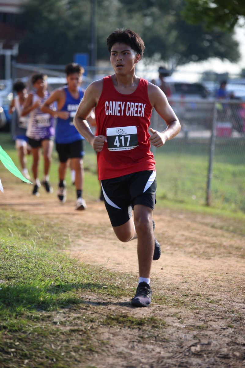 WORK ETHIC. Sophomore Esteban Sanchez pushed his hardest to get his new PR during the Longhorn Stampede meet on Sept. 18, 2025. "I was running a 5k,” Sanchez said. “I felt good and was trying to get a PR” Sanchez  said. 