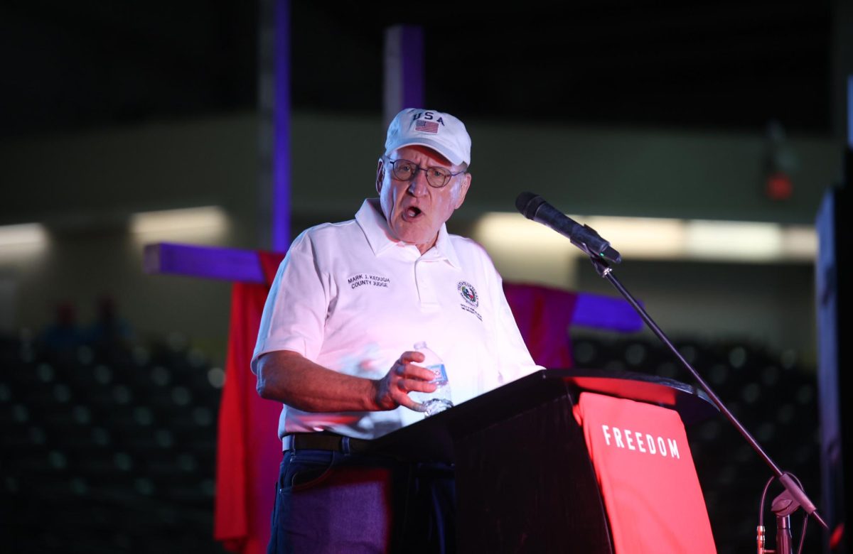 HE IS US. Montgomery County Judge Mark Keough speaks at the podium of the Montgomery Fairgrounds stadium during the Charlie Kirk Memorial Service Sept. 30. Keough said he was a longtime supporter of Kirk’s debates. “Charlie Kirk is Montgomery County,” Keough said. “And Montgomery County is Charlie Kirk.”