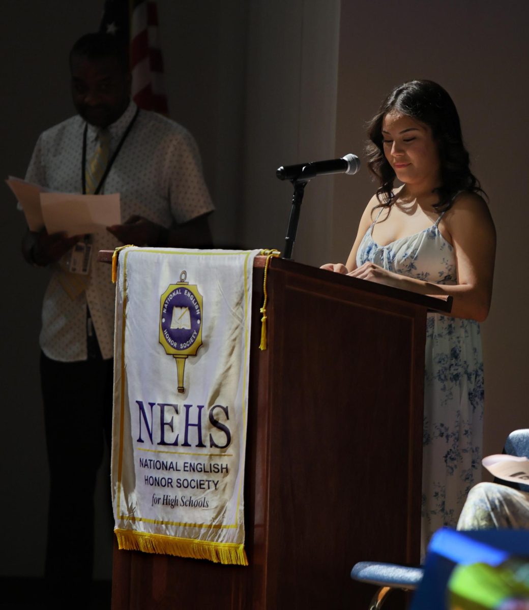 A FEW WORDS. Senior Britney Zapata  giving her speech before the new inductees walk up to receive their certificates on Sept. 9 2025. NEHS was welcoming the new members for 2025-26 year.