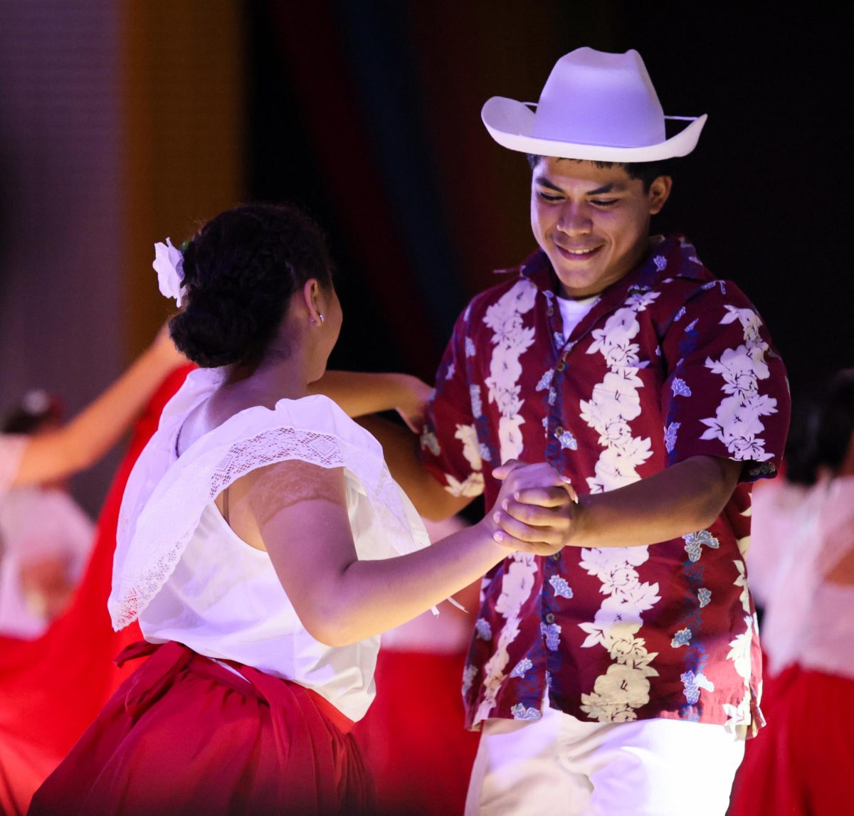 NEW EXPERIENCE. Junior Kristopher Gordillo dancing with a wide smile on his face on Sept. 11, 2025 with his dance partner, senior Betzabel Torres. This is his first dance competition of the year.