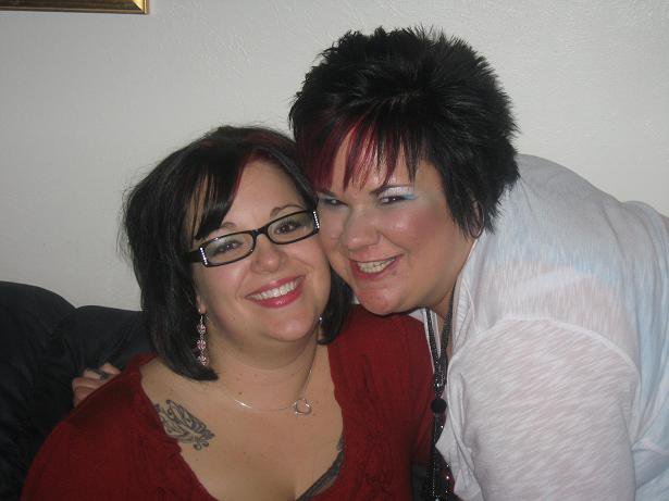 Mary Loveless-Day smiles next to her friend posing for a photo.