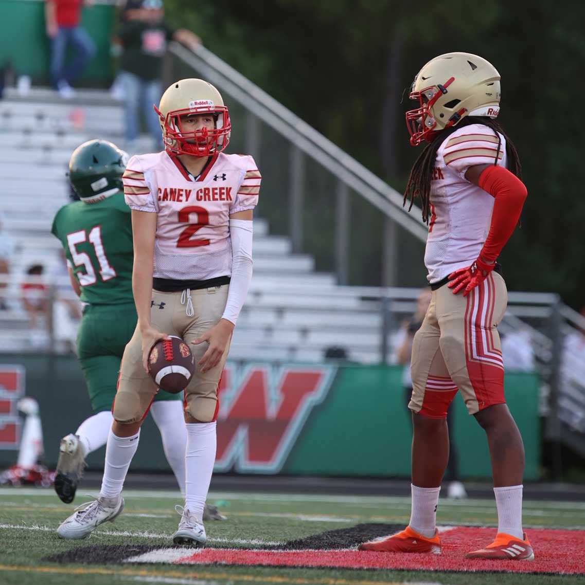 HEAD START. Freshman Deacon Perry is watching the quarterback grab the ball and thinking about what's next on Sept. 24, 2025. Perry was watching the ball get passed waiting for the opponents to make a move to grab the ball. 
