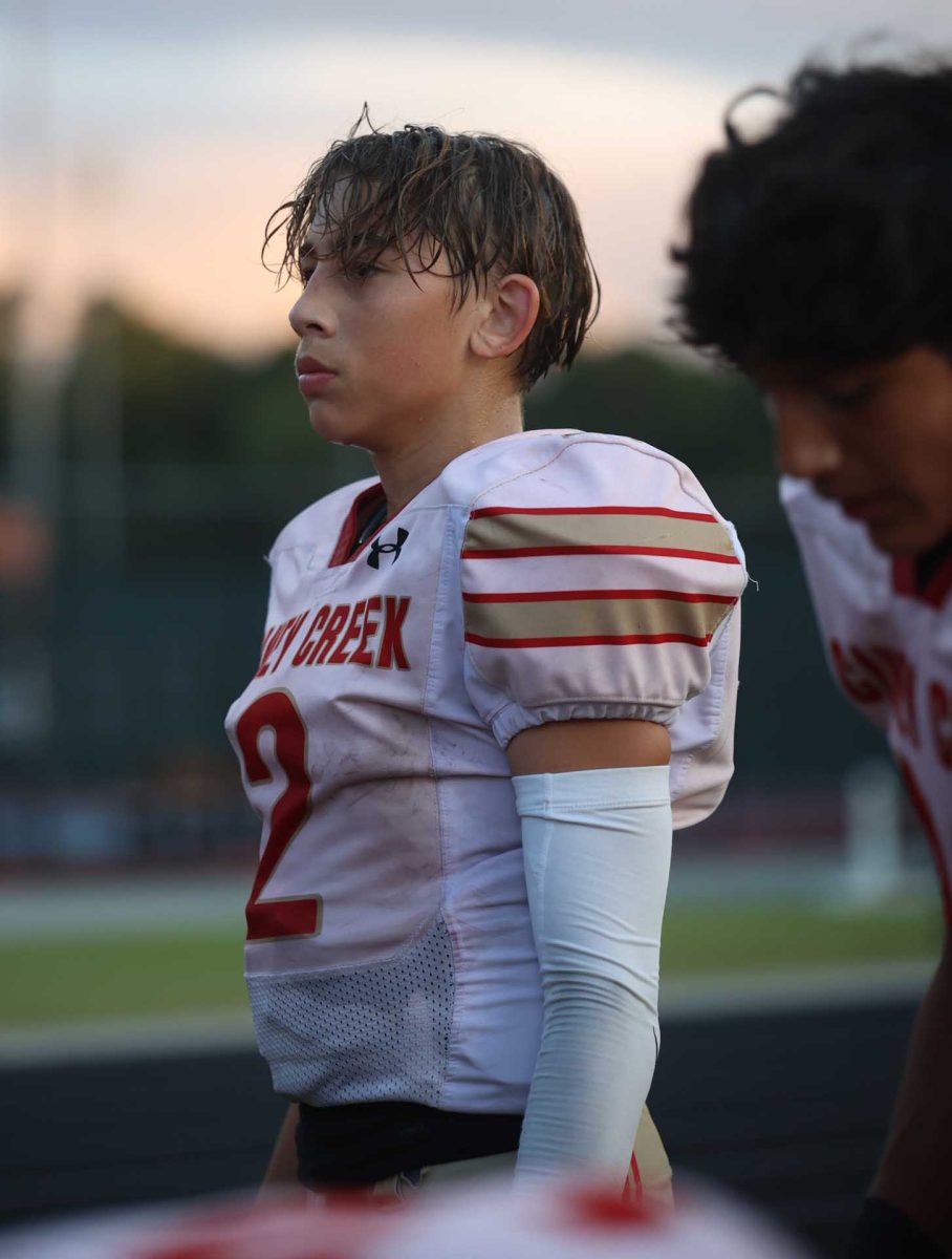  Freshman Kevin Cruz is warming up his kicking leg for the game Sept. 24, 2025.Cruz was  making sure his form is on point, while ensuring his leg is in the right position to kick as hard as he can.