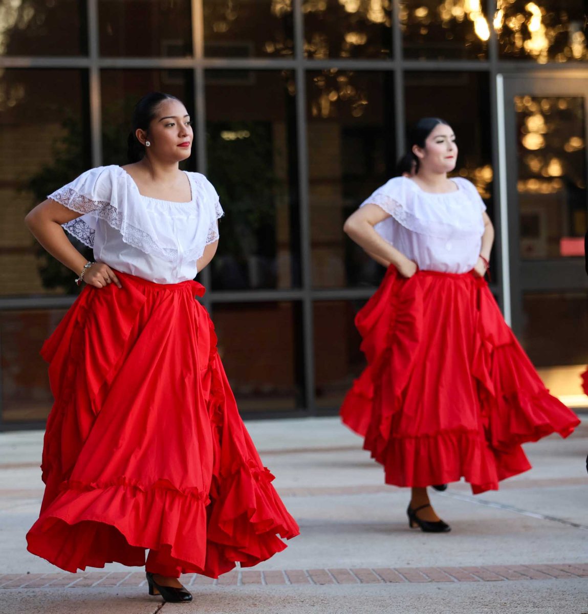 IN SYNC. Junior Carla Alfaro follows the choreography to “El Toro Mambo" on Oct. 14, 2025. In this dance, the girls act as the matadors with their red skirts and the boys are the bulls.