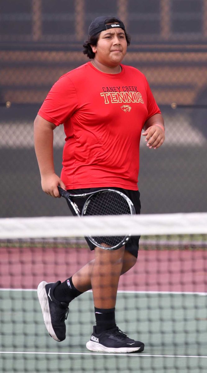 HIGH HOPES. Sophomore Isaiah Hernandez walks toward his tennis partner during the Oak Ridge match on Thursday, Sept. 23, 2025. Hernandez's team was losing, but wanted to maintain a positive energy throughout the tournament.