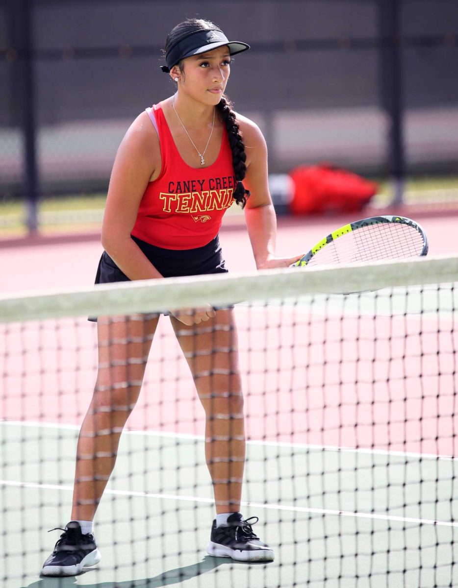 CARE. Junior Lilibeth Pachay watched as her opponent was about to serve on Thursday, Sept. 23, 2025 during the Oak Ridge game. Pachay was waiting for the ball to come her way, staying motivated even while she and her teammate were losing. “I think we all need to work on staying positive the whole game,” Pachay said. “Our teams play well and every person puts their effort into each game.”