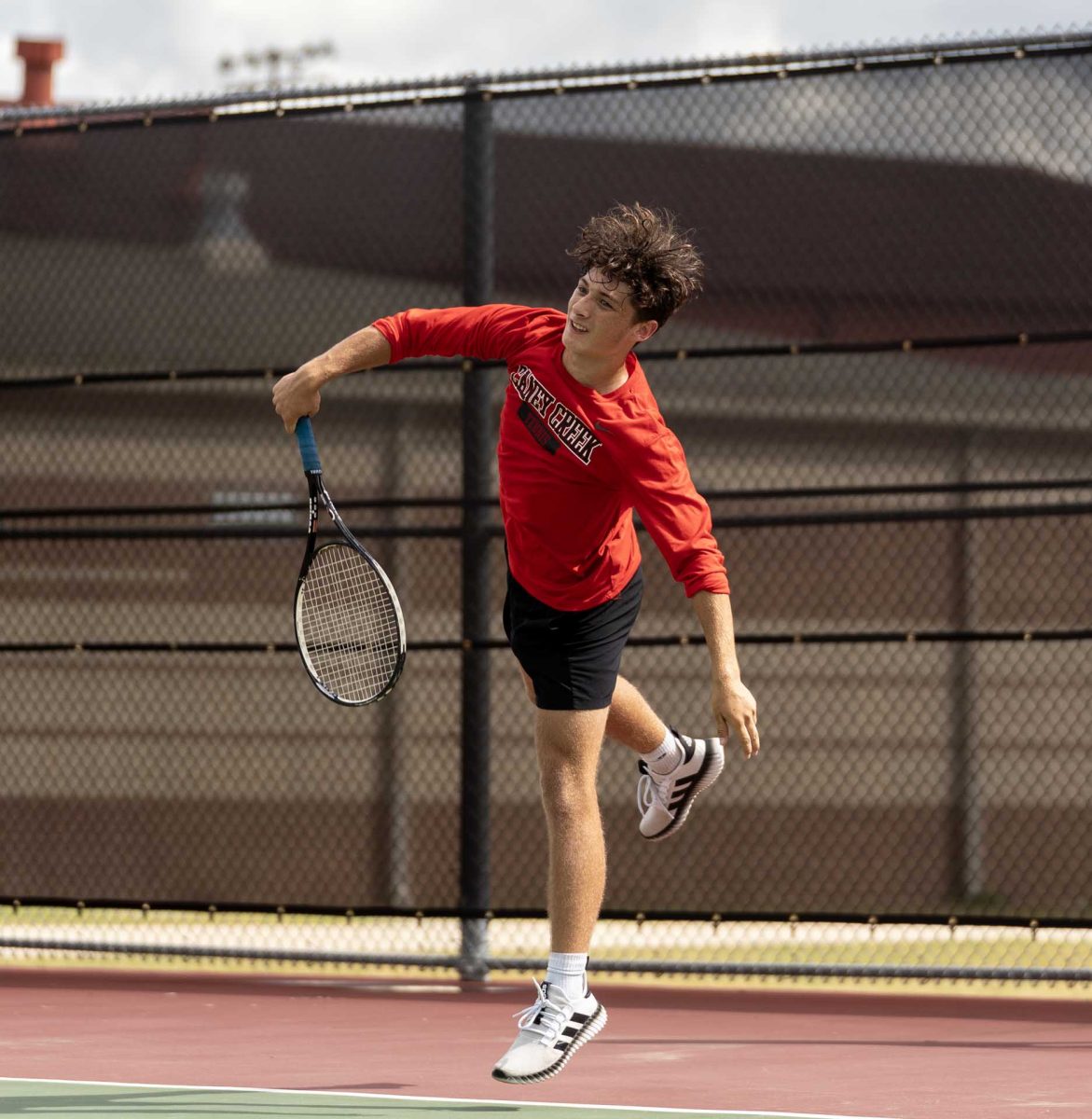 FLOW. Sophomore Corbin Hornsby focused on maintaining consistency during his serves as he competed in his match against Oak Ridge on Thursday, Sept. 23, 2025. “I was serving the ball, and the game didn't go so well,” Hornsby said. “I felt like I did good, my serves were well.” 