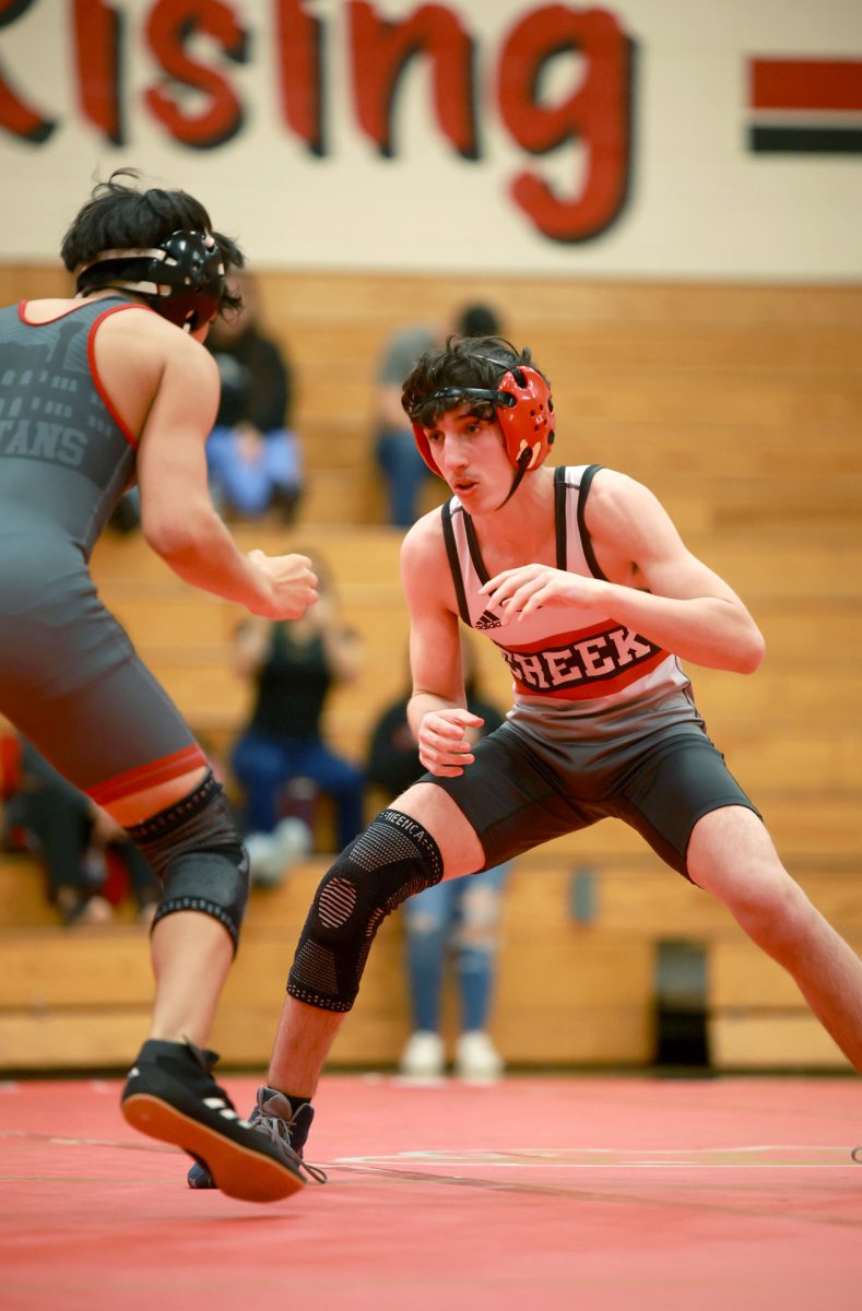 SWING. Sophomore Gage Clark looks for an opportunity to get his opponent down during a home match against Cypress Lakes on Jan 8, 2026. Clark, tired and ready for the match to be over, was desperate for an opening finding strength to win. “That was a pretty good match, I think I did good,”Clark said.