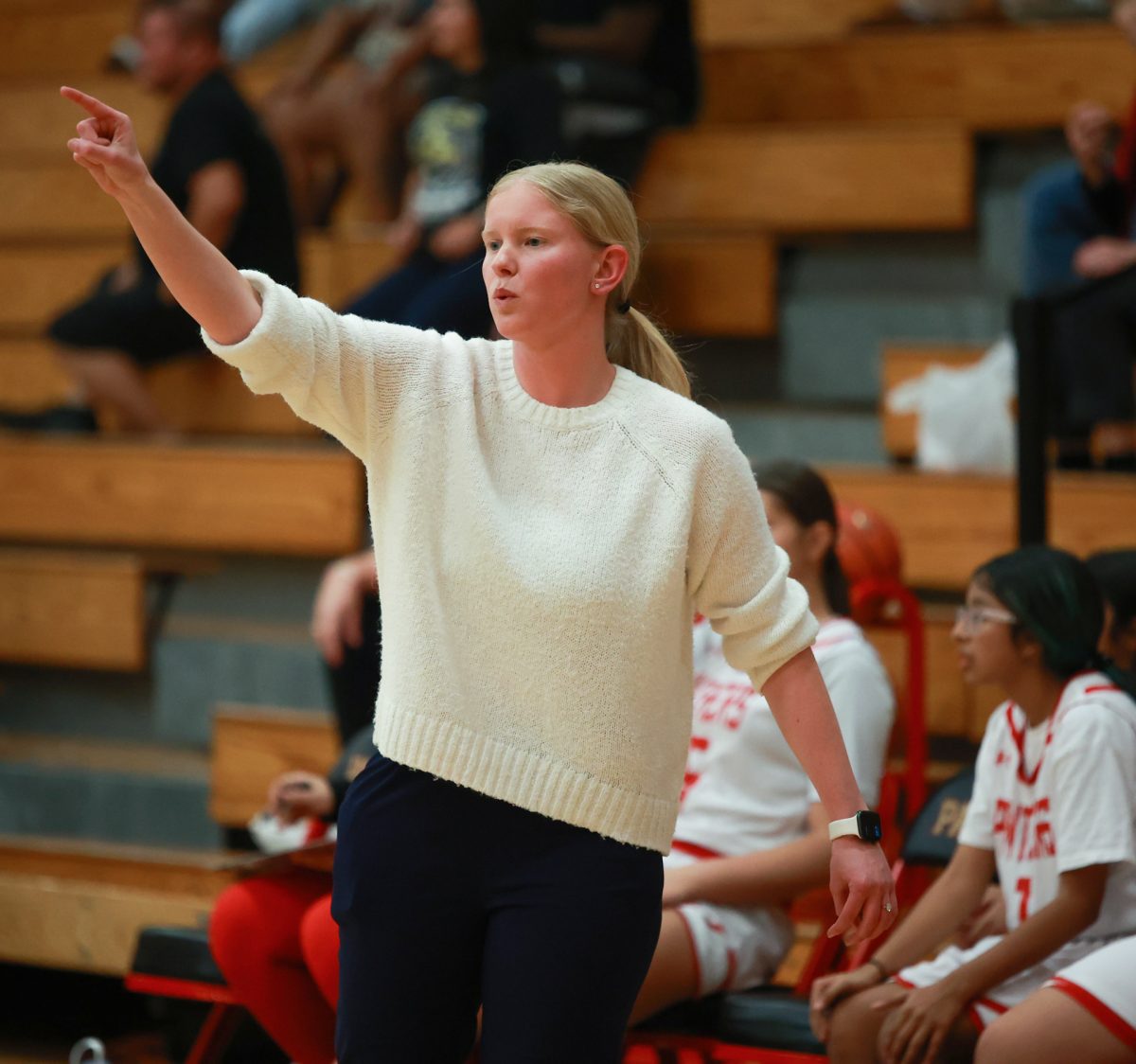COMMAND MODE. Coach Gorden giving directions during overtime against Conroe on Jan. 09, 2026 “I’m so happy that we squeezed through the win. It was a very tight game but my girls made it with the win,” Gordon said.