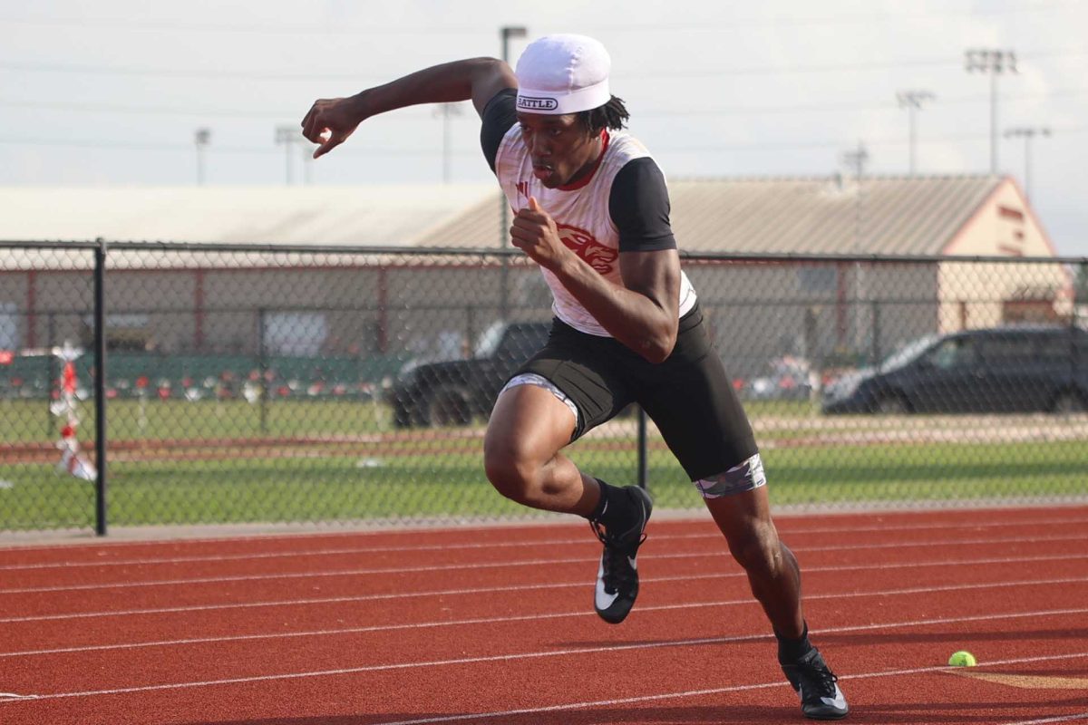 SPEED UP. Sophomore Amarien Hughes was the second leg in the 4x2 relay on Thursday March 6, 2026. When the first leg gave Hughes the baton he sprinted off and was able to get a lead for Caney Creek.