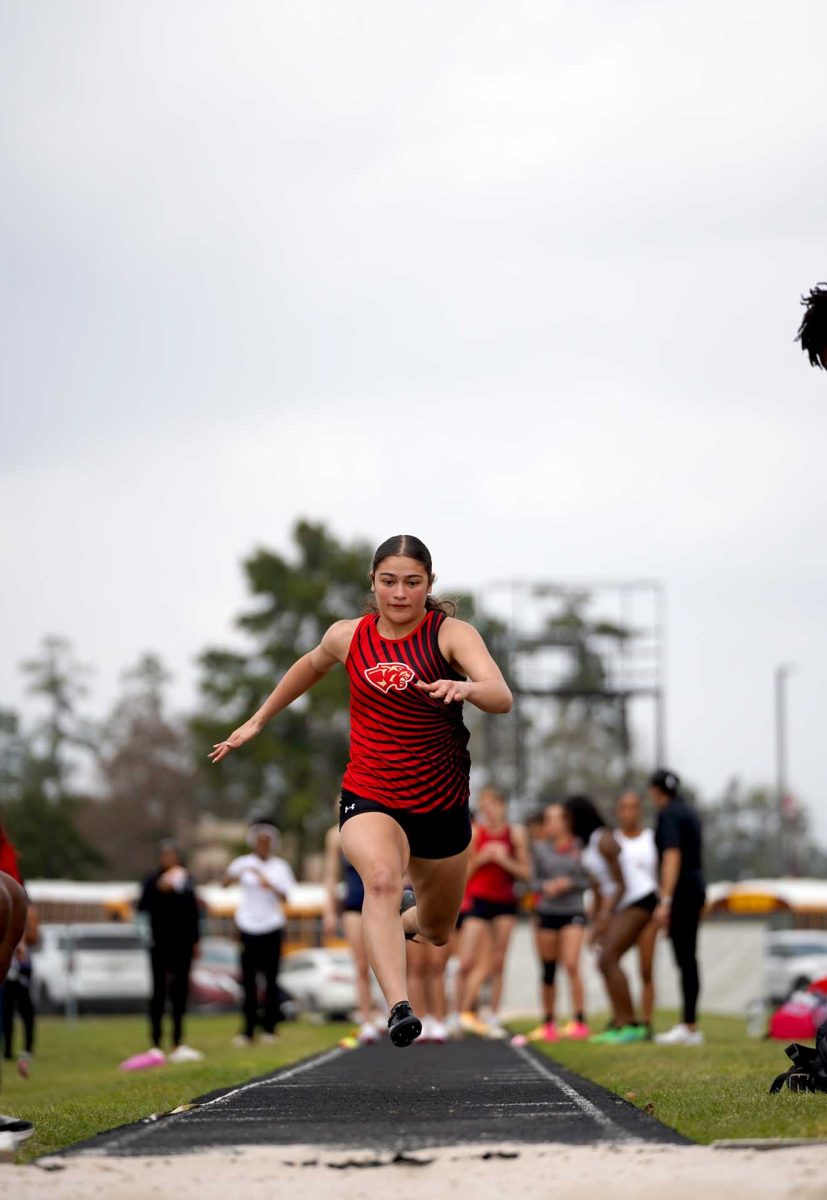 STRIDE STRIDE. Senior Hannah Javadian strides through the long jump course at the Panther Relay Meet on Thursday Feb, 26. Javadian was making her practice runs before she started her jumps.   