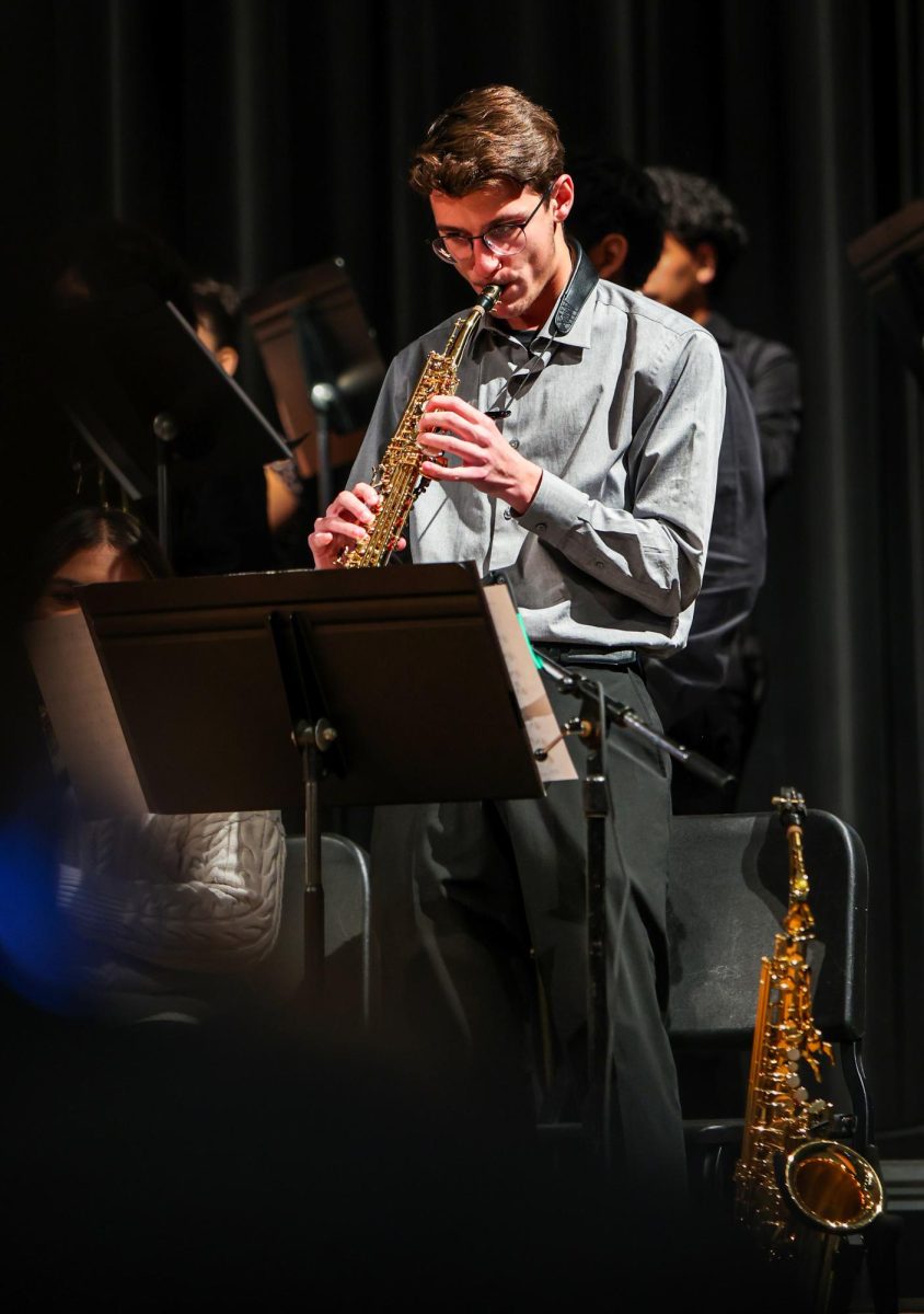JAZZY TUNES. Junior Conner Dooley plays a saxophone solo during the Jazz Concert on Monday, Feb 16, 2026. Dooley had several solos during the night giving him the spotlight. “I was honestly just listening to the music,” Dooley said. “I was playing with my heart.”