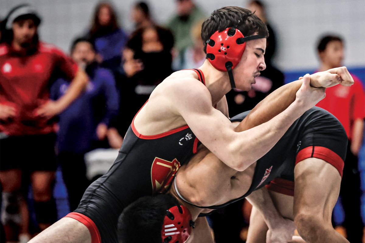 Sophomore Julien Ndebi grapples an opponent during the match against Westside at the Chicken Wing Invitational Jan. 10, 2026.