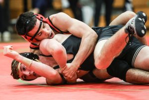 Sophomore Julien Ndebi grapples an opponent during a match at the Katy Jordan meet Nov. 12, 2025.
